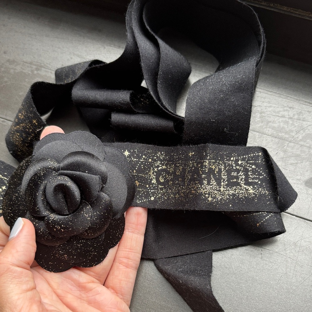 CHANEL Black ribbon with Gold Floral Accent